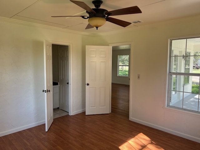 unfurnished bedroom with dark hardwood / wood-style flooring, ceiling fan, and ornamental molding