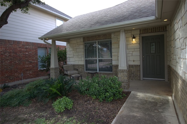 view of exterior entry featuring a porch