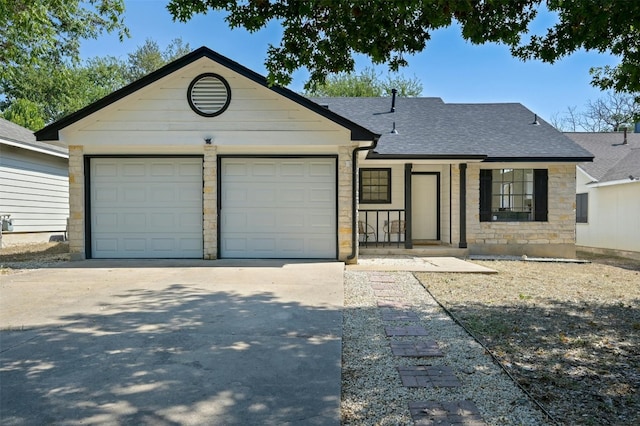 single story home with a porch and a garage