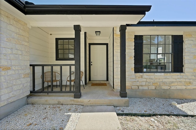 doorway to property with a porch