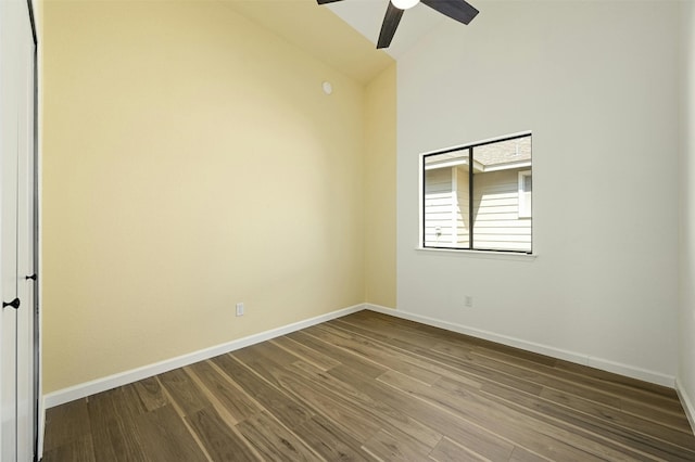 spare room with hardwood / wood-style flooring, ceiling fan, and high vaulted ceiling