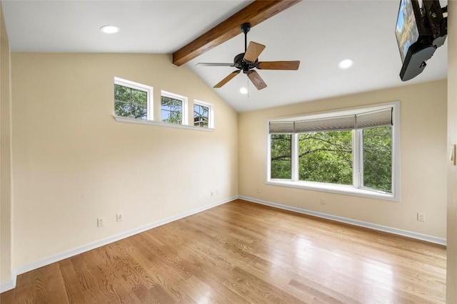 spare room featuring ceiling fan, vaulted ceiling with beams, and light hardwood / wood-style floors