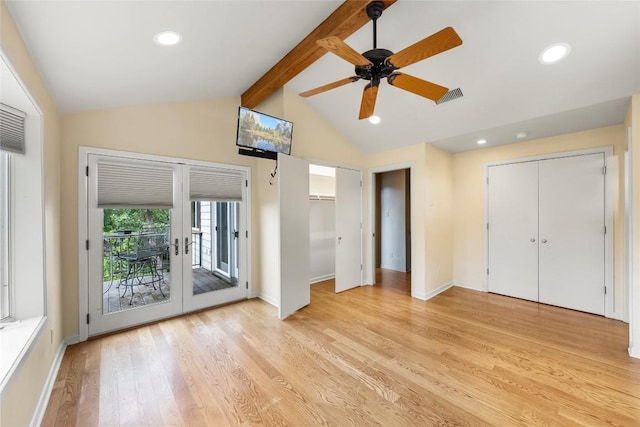 unfurnished bedroom featuring vaulted ceiling with beams, light hardwood / wood-style flooring, access to outside, ceiling fan, and french doors