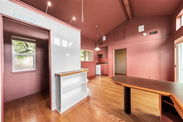 interior space with pendant lighting, dishwasher, hardwood / wood-style floors, high vaulted ceiling, and beamed ceiling