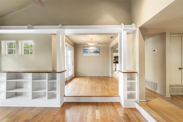 interior space featuring visible vents and wood finished floors