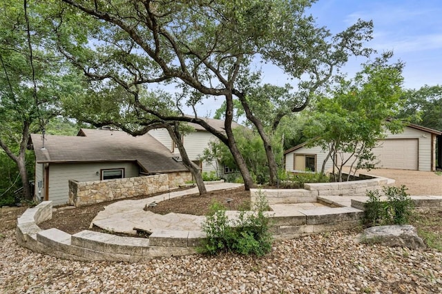 exterior space with a detached garage