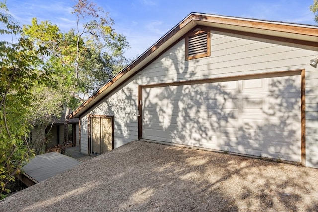 view of side of home with driveway