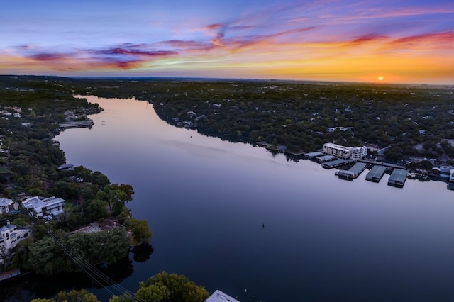 aerial view at dusk with a water view