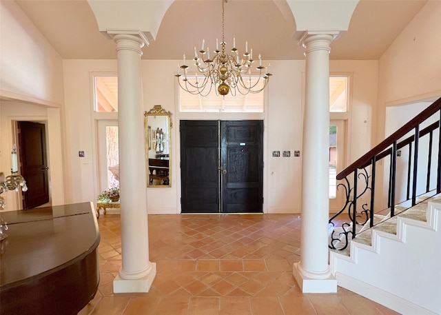 entrance foyer with a notable chandelier and a high ceiling