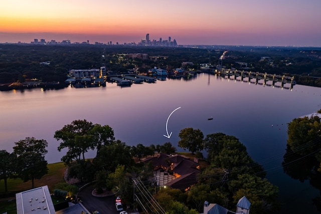 aerial view at dusk with a water view