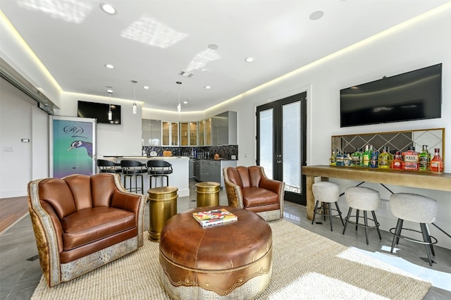 living room featuring bar and french doors