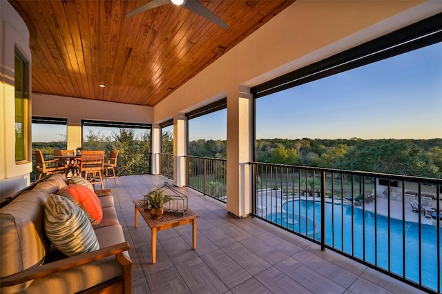 exterior space featuring ceiling fan