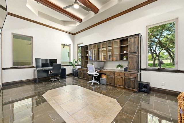 office area with a high ceiling, crown molding, ceiling fan, built in desk, and beam ceiling