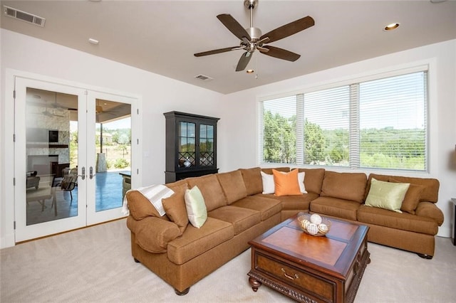 living area featuring recessed lighting, visible vents, light carpet, and ceiling fan