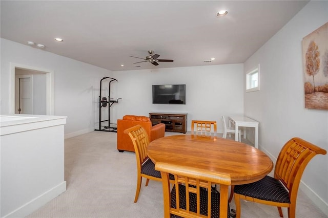 dining space with light carpet, recessed lighting, baseboards, and ceiling fan