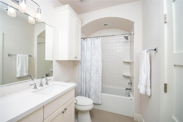 full bathroom with tile patterned floors, toilet, shower / bath combo, and vanity