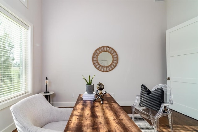 sitting room featuring baseboards, plenty of natural light, and visible vents