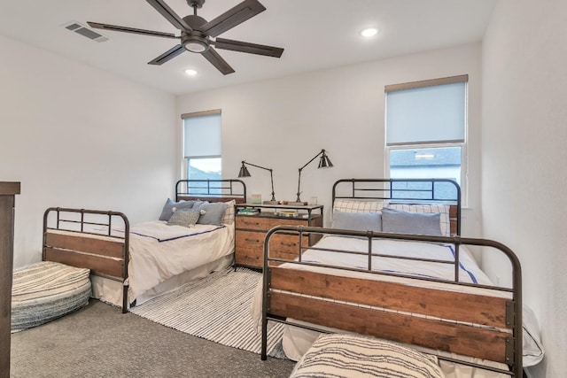 bedroom with ceiling fan and carpet