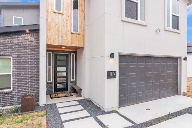 view of exterior entry featuring a garage