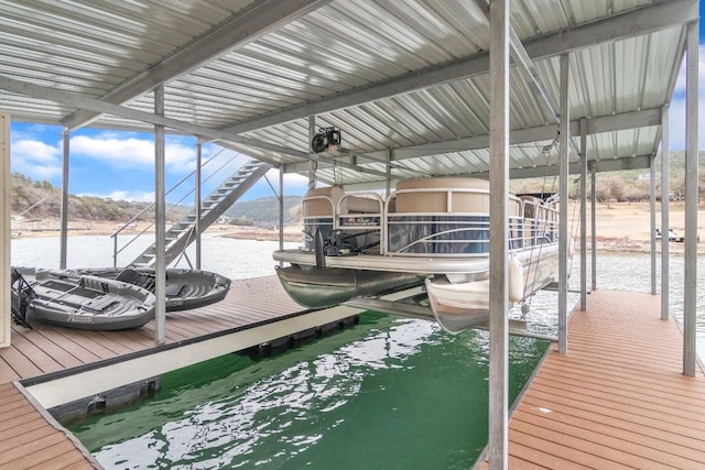 dock area with a water view