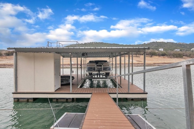 dock area with a water and mountain view