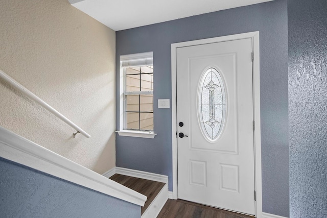 foyer with dark hardwood / wood-style floors