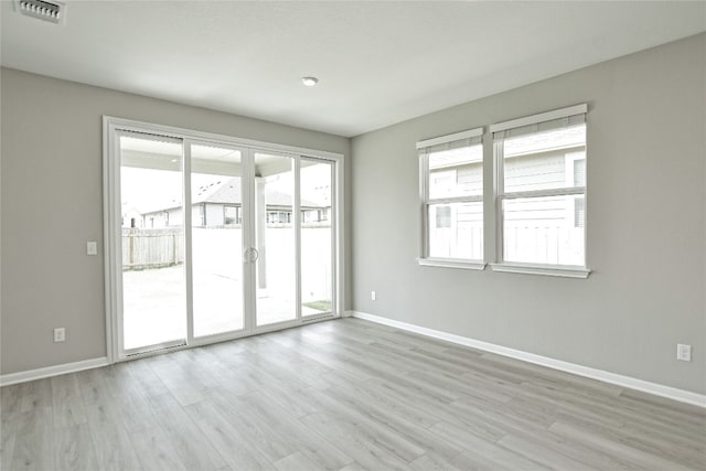 spare room featuring hardwood / wood-style floors