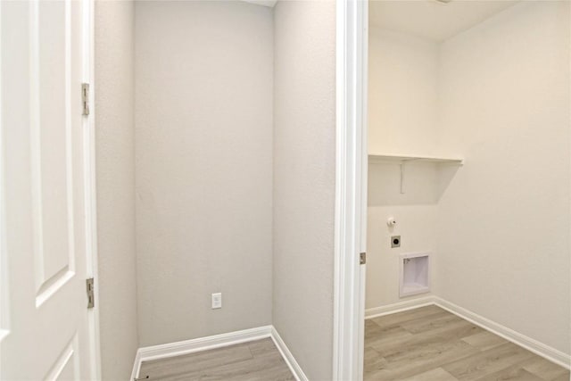 laundry room with laundry area, attic access, baseboards, light wood-style flooring, and hookup for an electric dryer