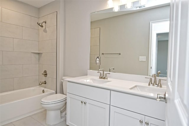 bathroom featuring shower / bath combination, a sink, toilet, and double vanity