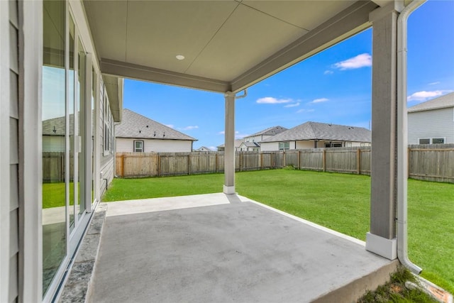 view of patio featuring a fenced backyard and a residential view