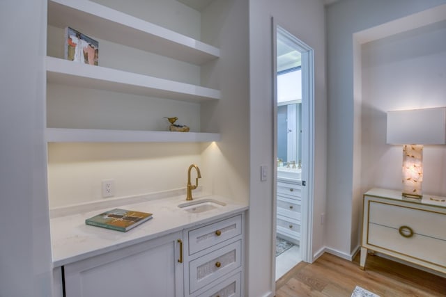 interior space featuring hardwood / wood-style flooring and vanity