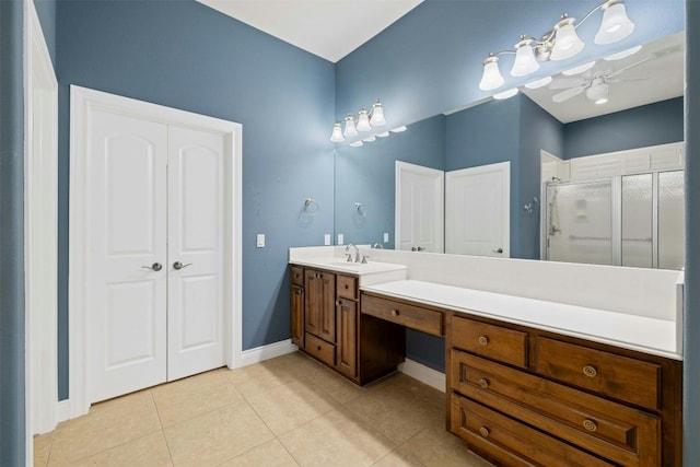 bathroom featuring vanity, ceiling fan, an enclosed shower, and tile patterned flooring