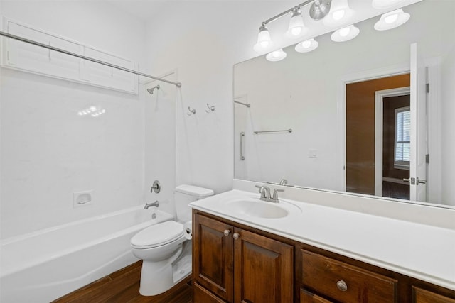 full bathroom featuring bathing tub / shower combination, vanity, wood-type flooring, and toilet