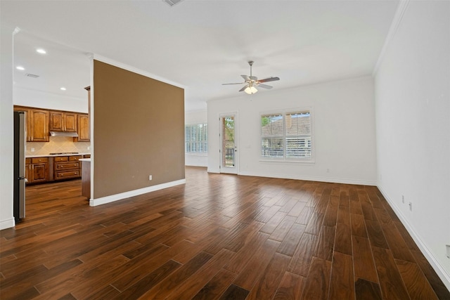 unfurnished living room featuring ceiling fan, dark wood-type flooring, and ornamental molding