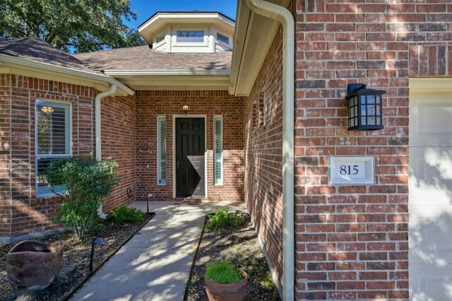 doorway to property featuring a garage