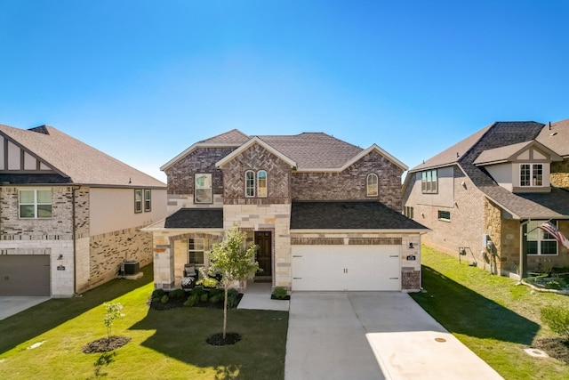 view of front of home featuring central AC, a front yard, and a garage