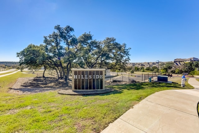 view of property's community with a lawn