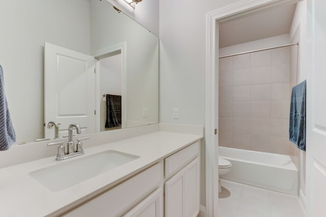 full bath with bathtub / shower combination, tile patterned flooring, vanity, and toilet