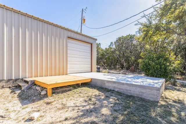 exterior space featuring an outdoor structure and a garage