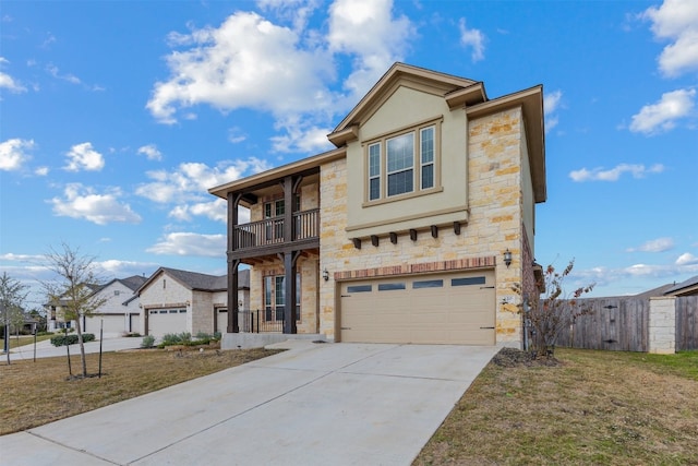 view of front of home with a balcony, a garage, and a front lawn