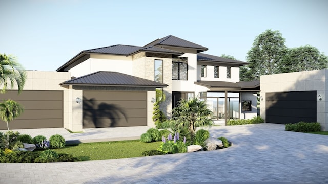 view of front of house featuring a garage, driveway, and stucco siding