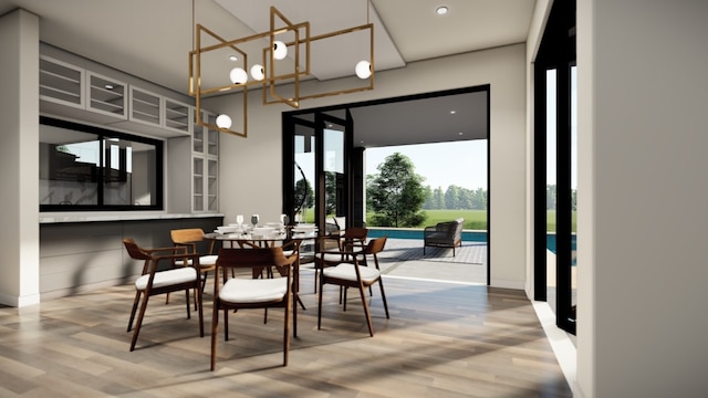 dining area featuring an inviting chandelier, wood finished floors, and recessed lighting