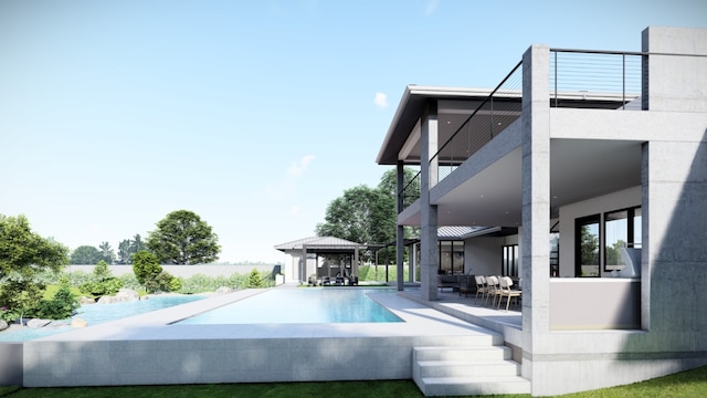 back of house featuring outdoor lounge area, a gazebo, and an infinity pool