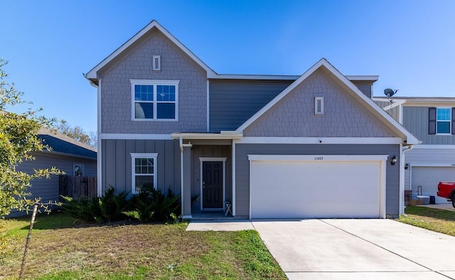 view of front facade featuring a garage, a front yard, driveway, and fence