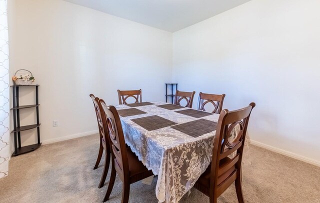 view of carpeted dining space