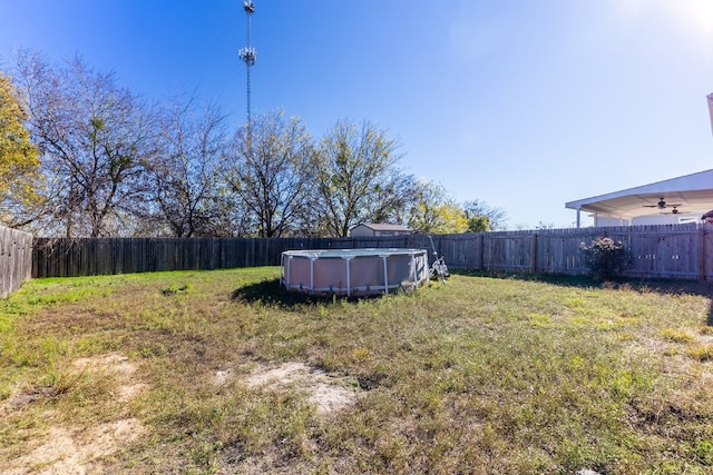 view of yard featuring a fenced in pool