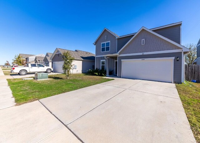 view of front facade featuring a front lawn and a garage