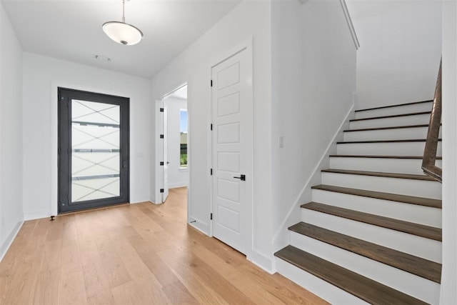 entryway with light hardwood / wood-style floors