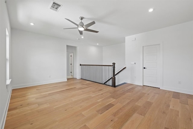 spare room with light hardwood / wood-style flooring and ceiling fan