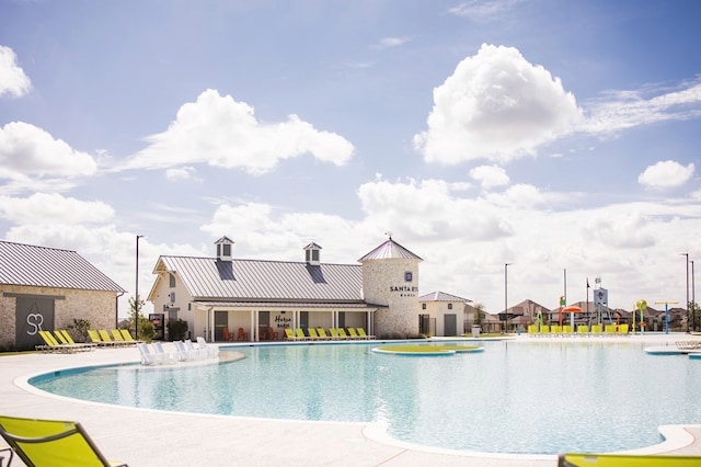 view of pool featuring a patio